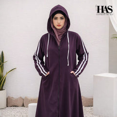 A woman is wearing a modest, sporty-style long outer garment in a deep  color.