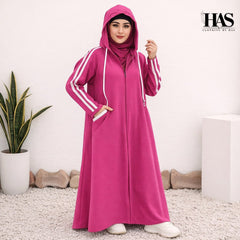 A woman is wearing a modest, sporty-style long outer garment in a deep  color.